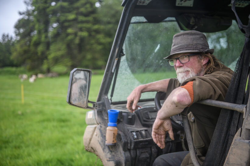 Portrait of farmer sitting in off road vehicle