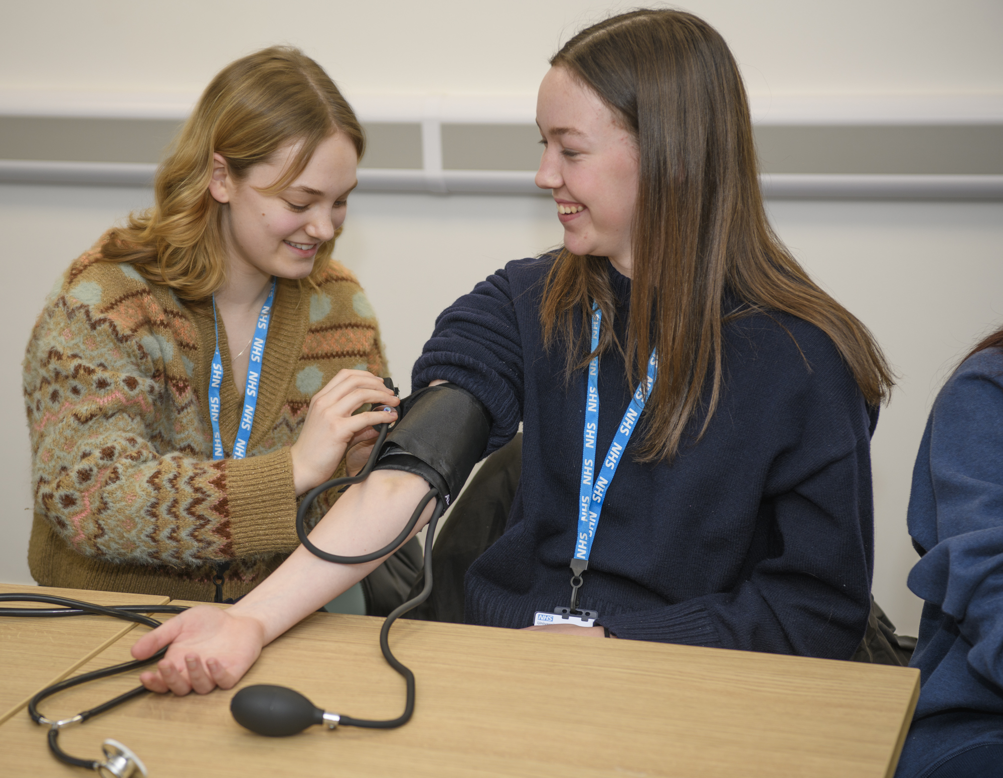 Students learning how to measure blood pressure