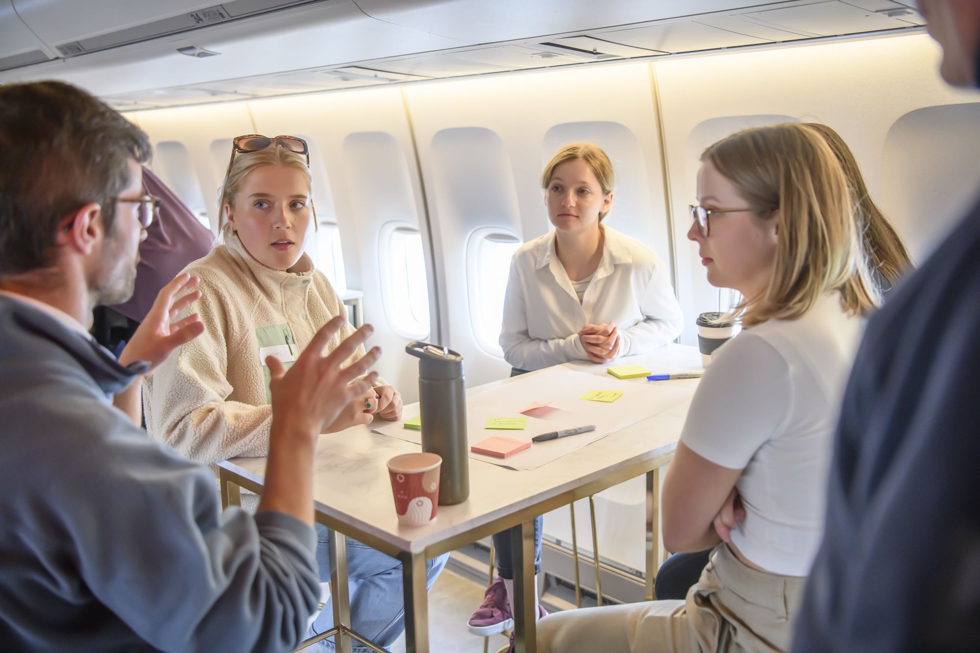 Debrief session after medical emergency simulation on a plane